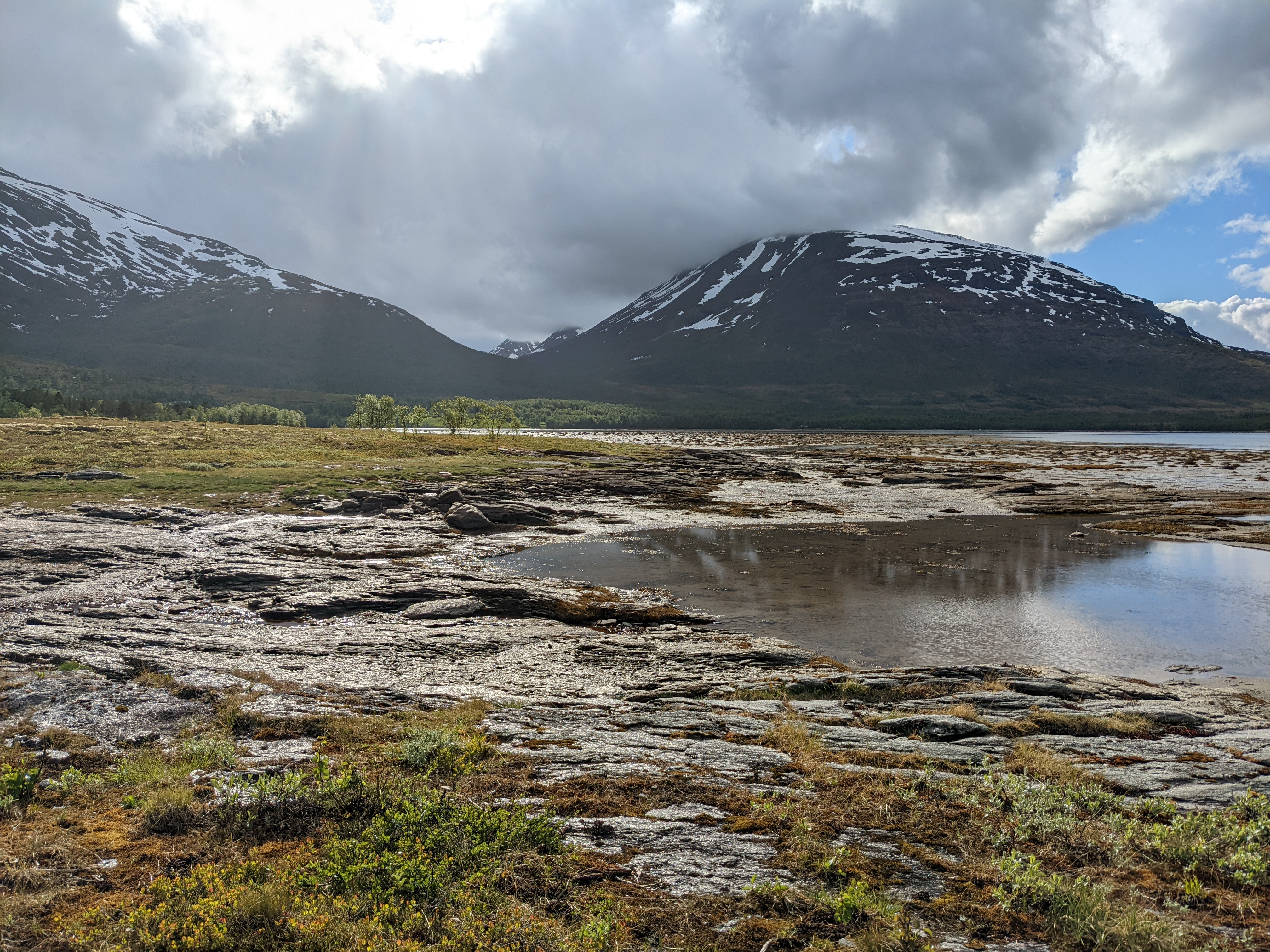 soft, rounded mountains backdrop another tide pool