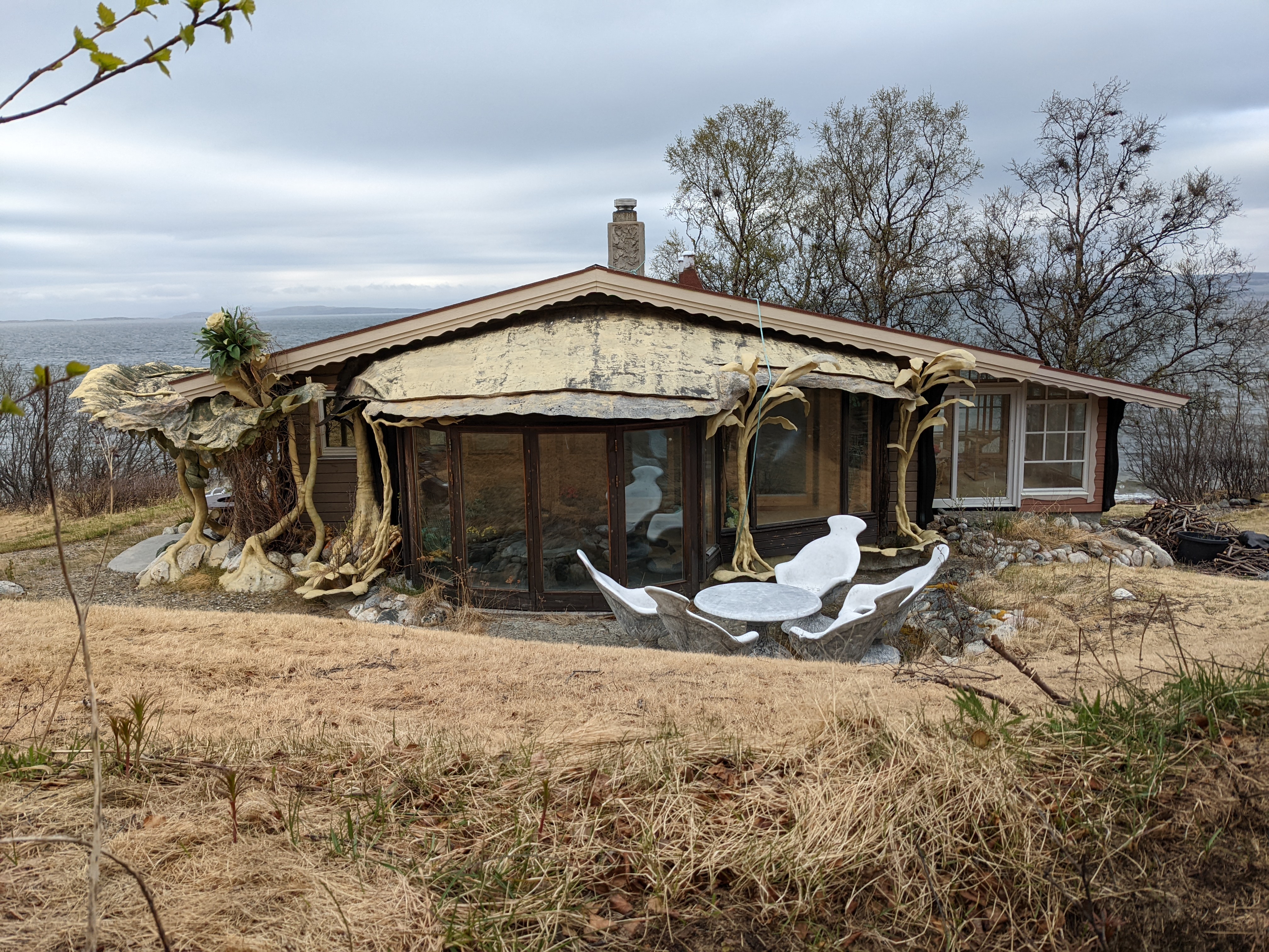 A house with very strange ornamentation made to look like plants