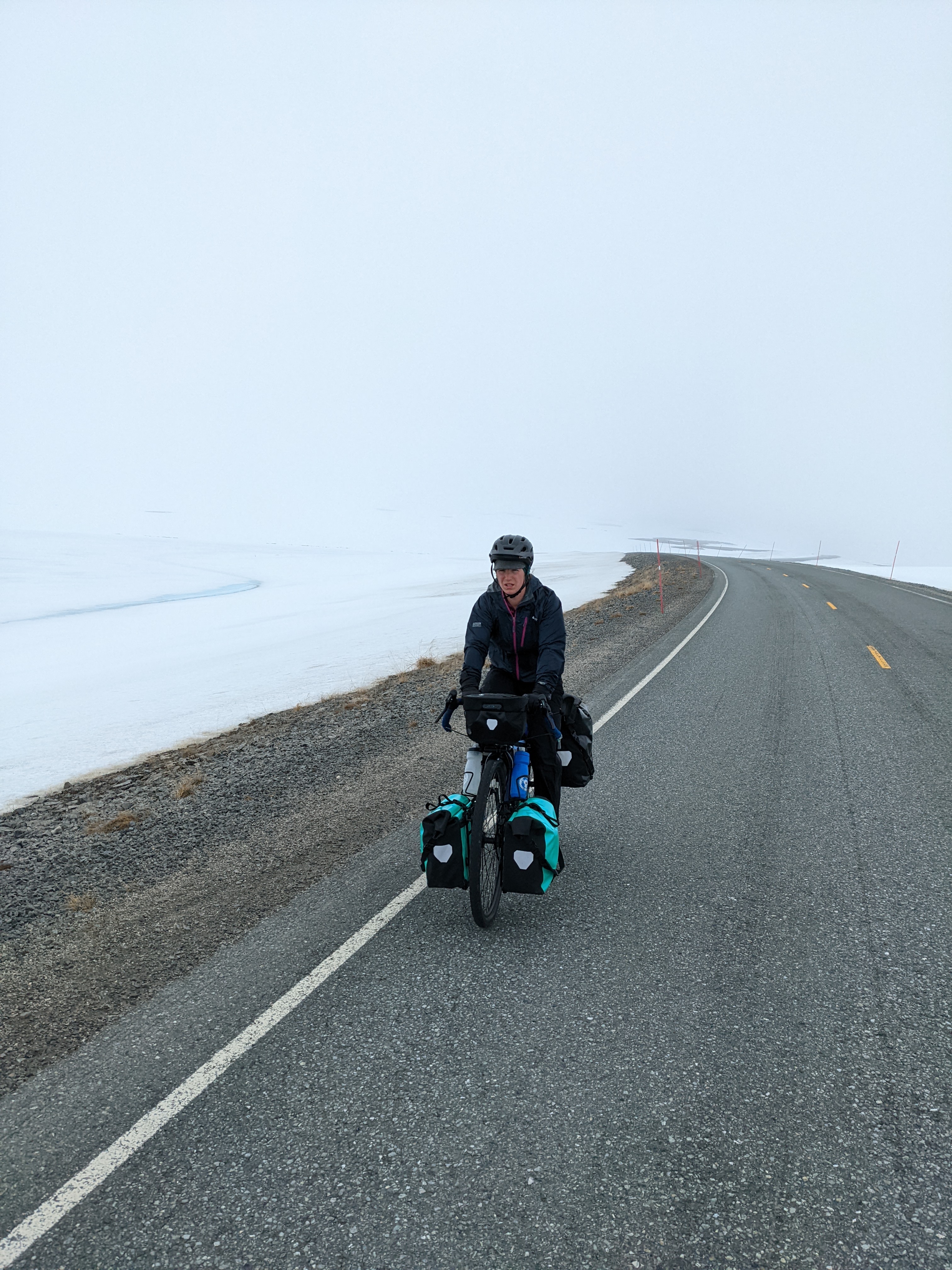 H riding uphill as the bad weather started to come in