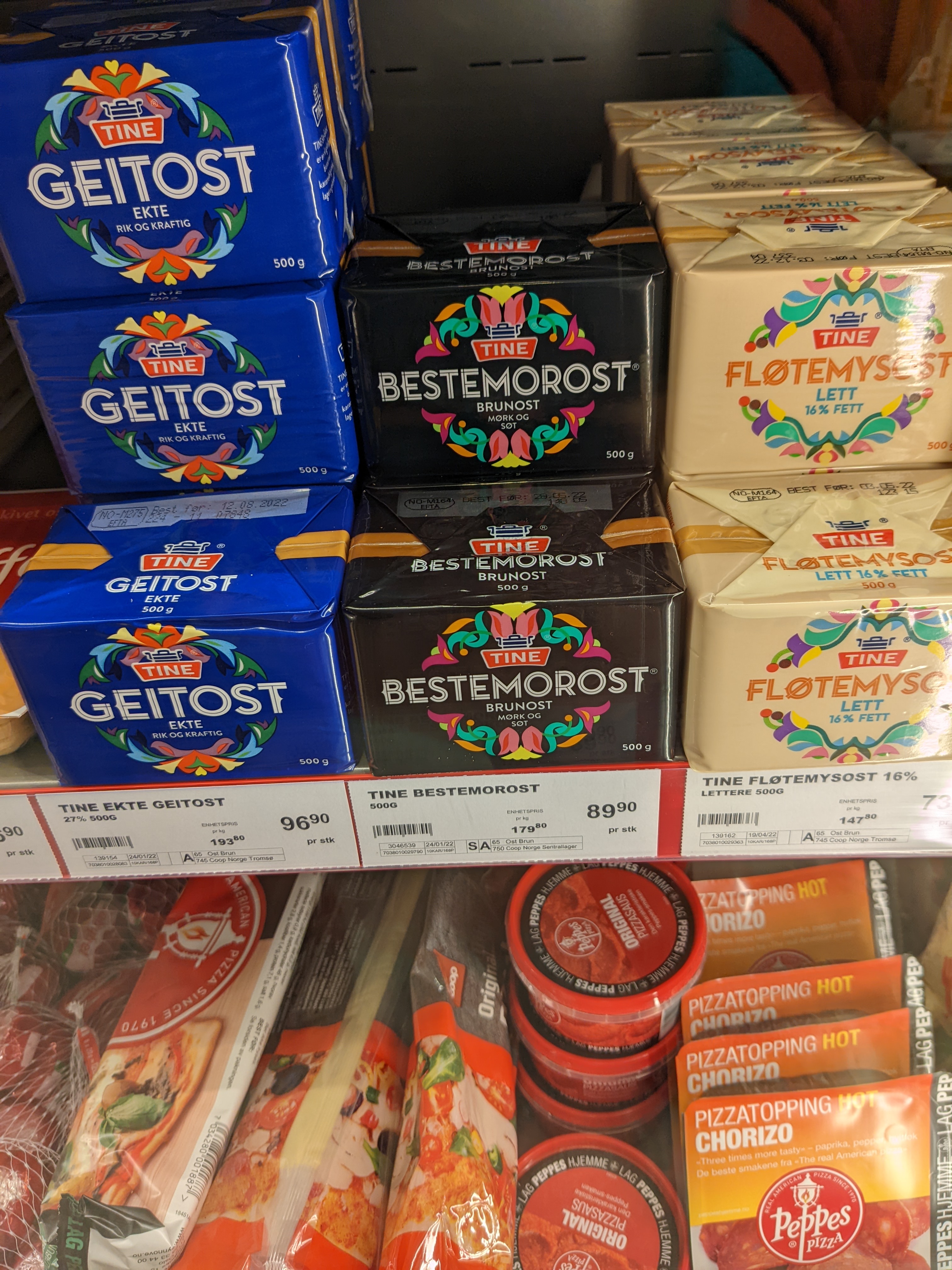 three flavors of brunost on a grocery shelf