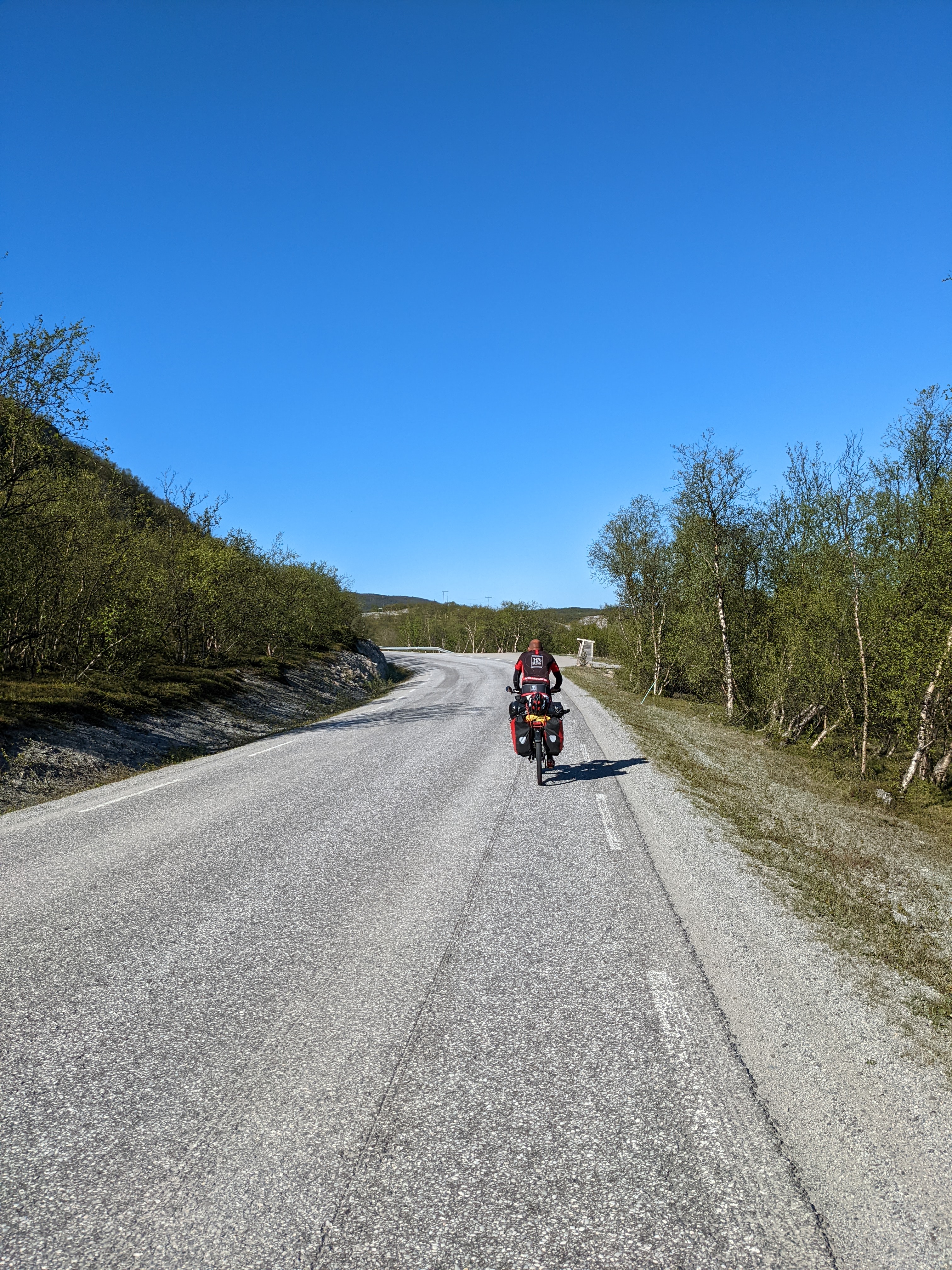 cyclist with panniers riding north