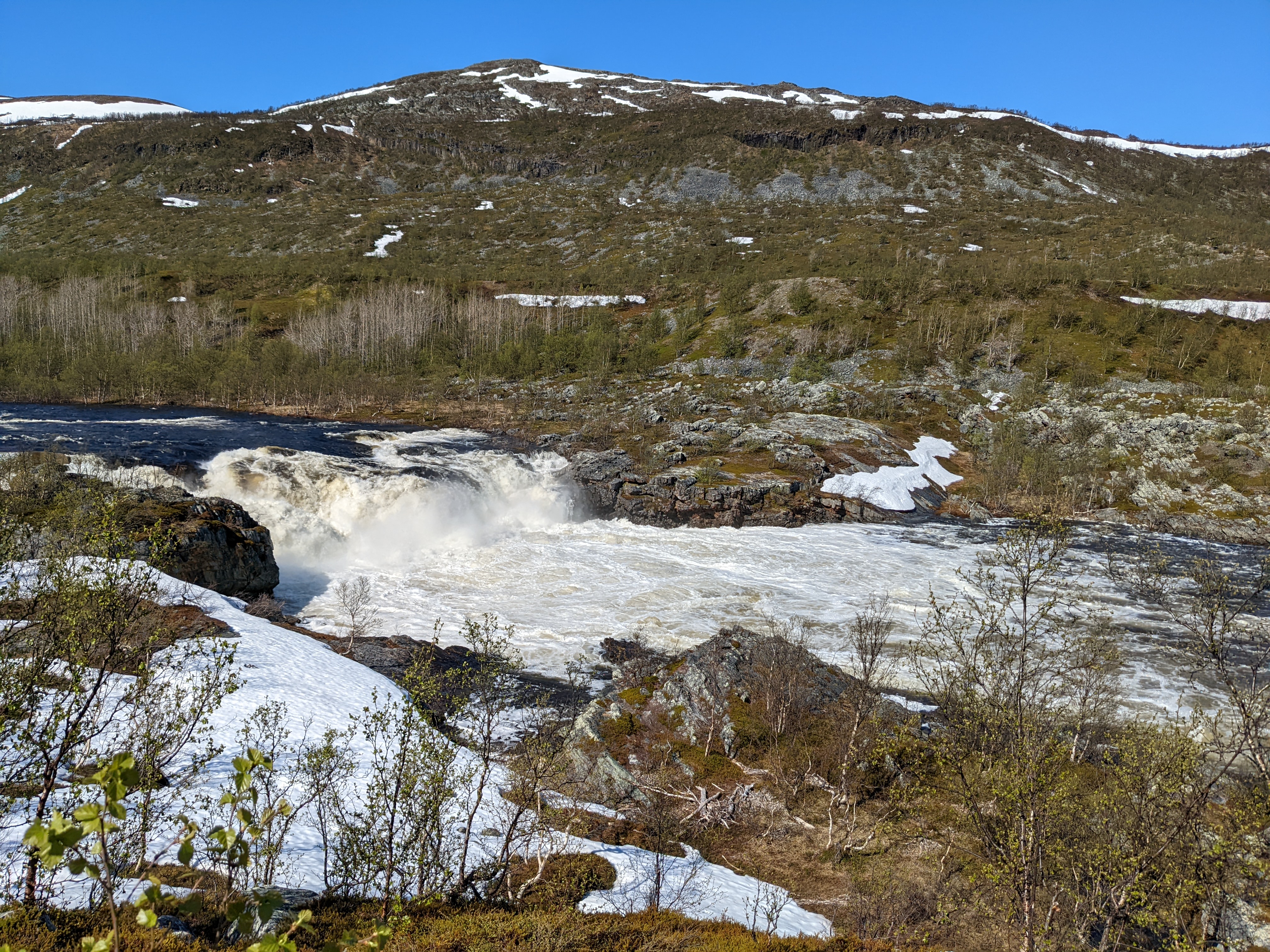 A waterfall on the Stabburselva, churning white in spring flood conditions