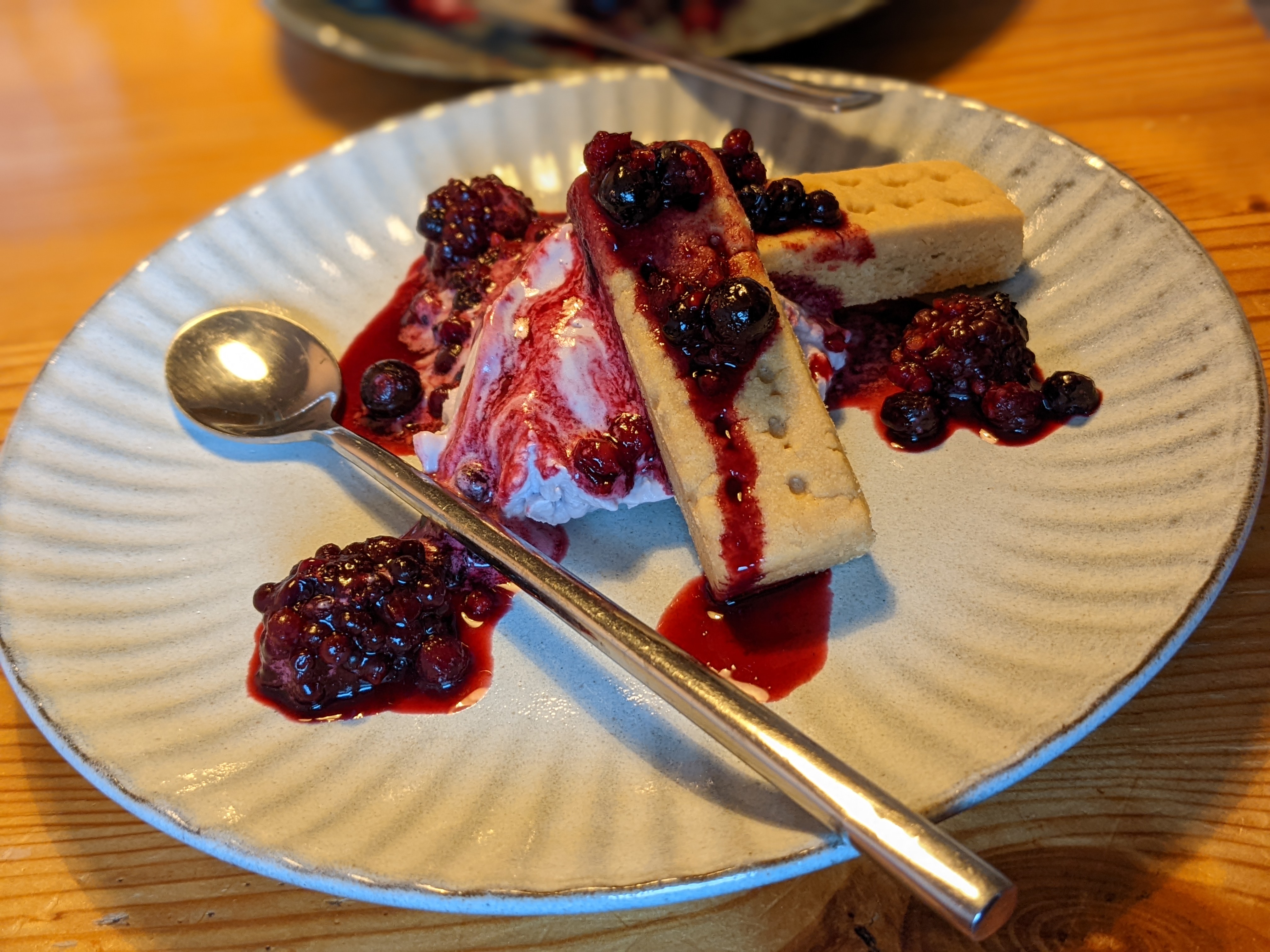 shortbread cookies with raspberry whipped cream and berry sauce