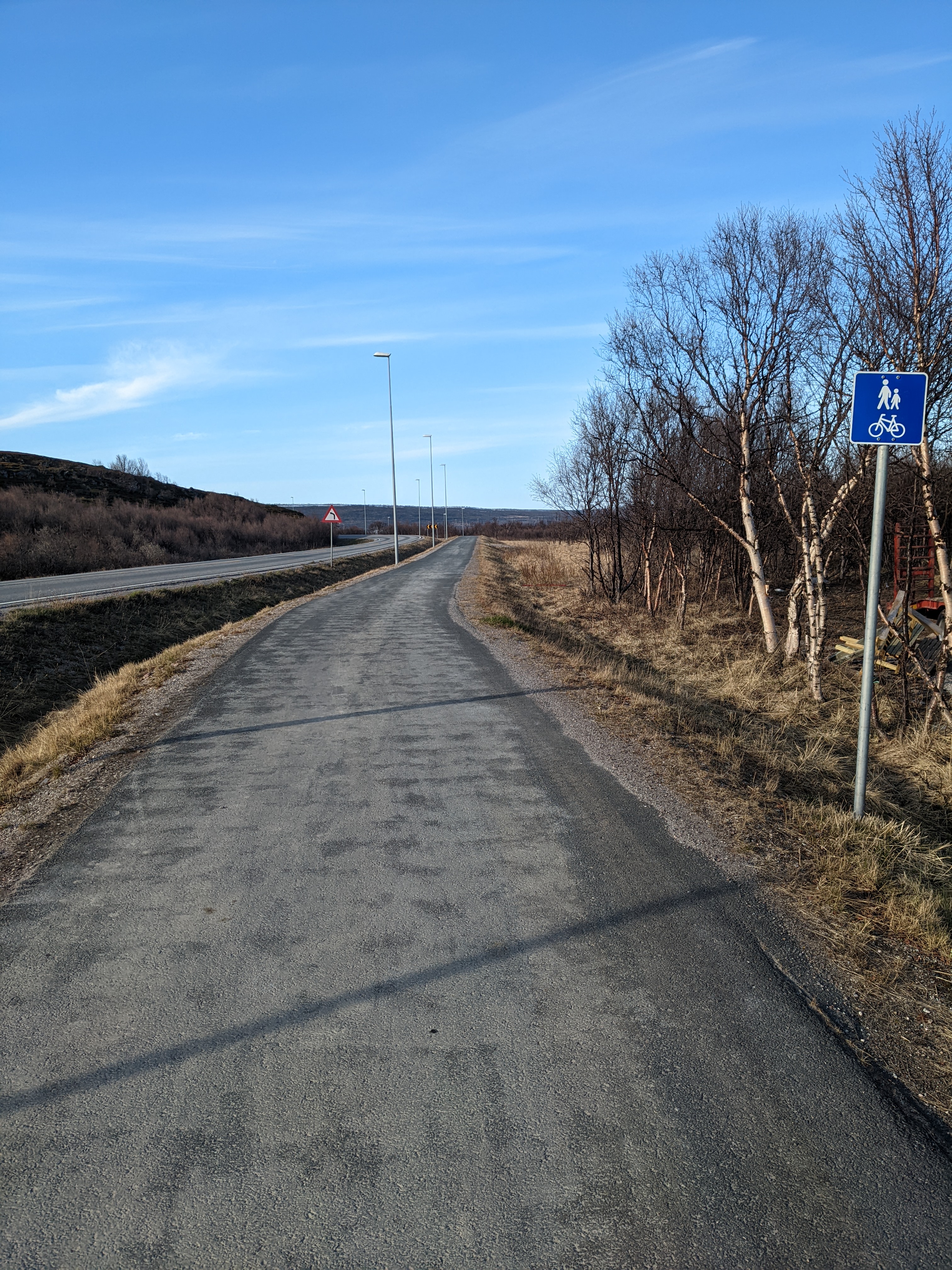 a typically well-paved and broad pedestrian way in a small town