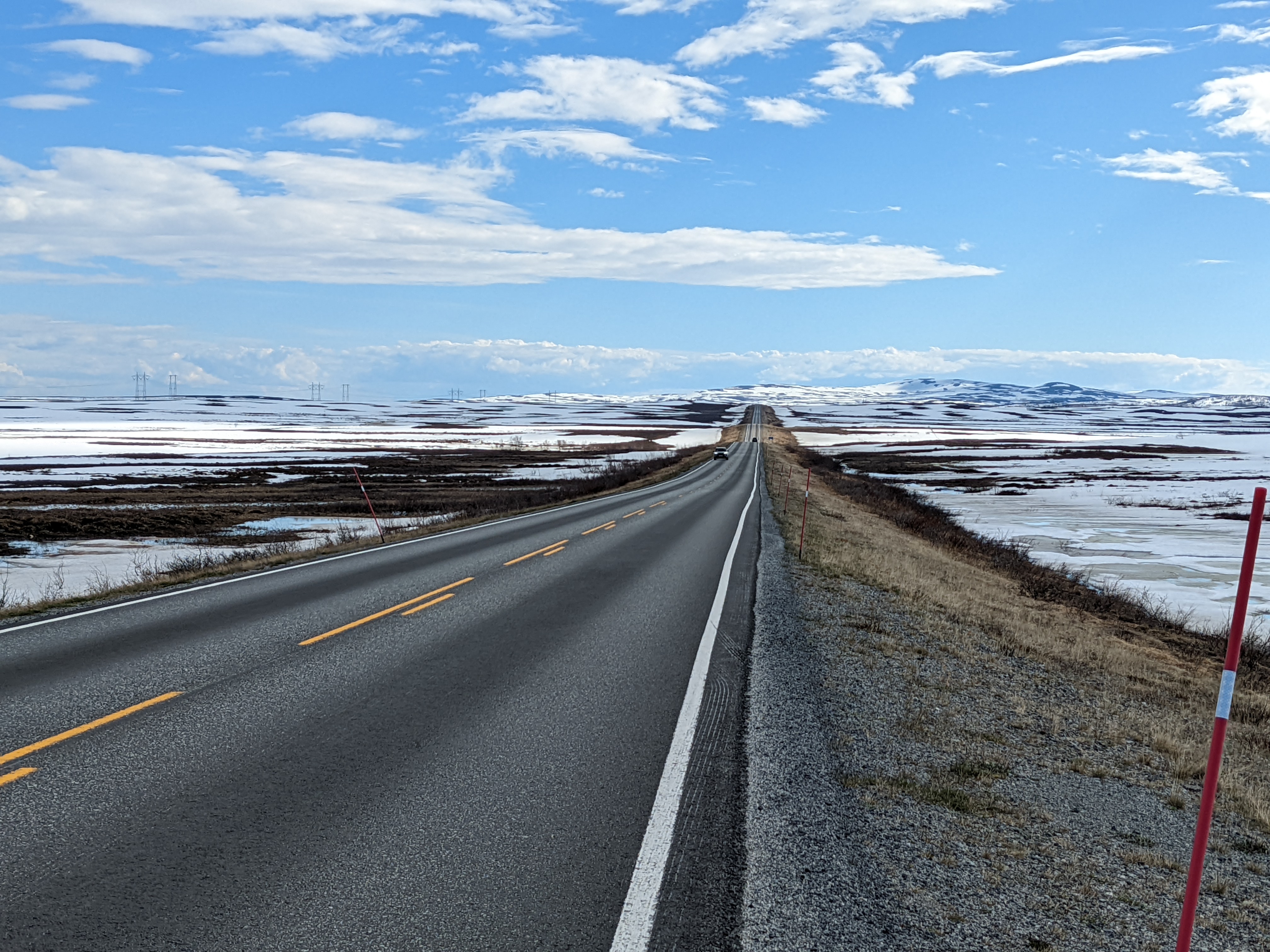 long, rolling road through snowy country