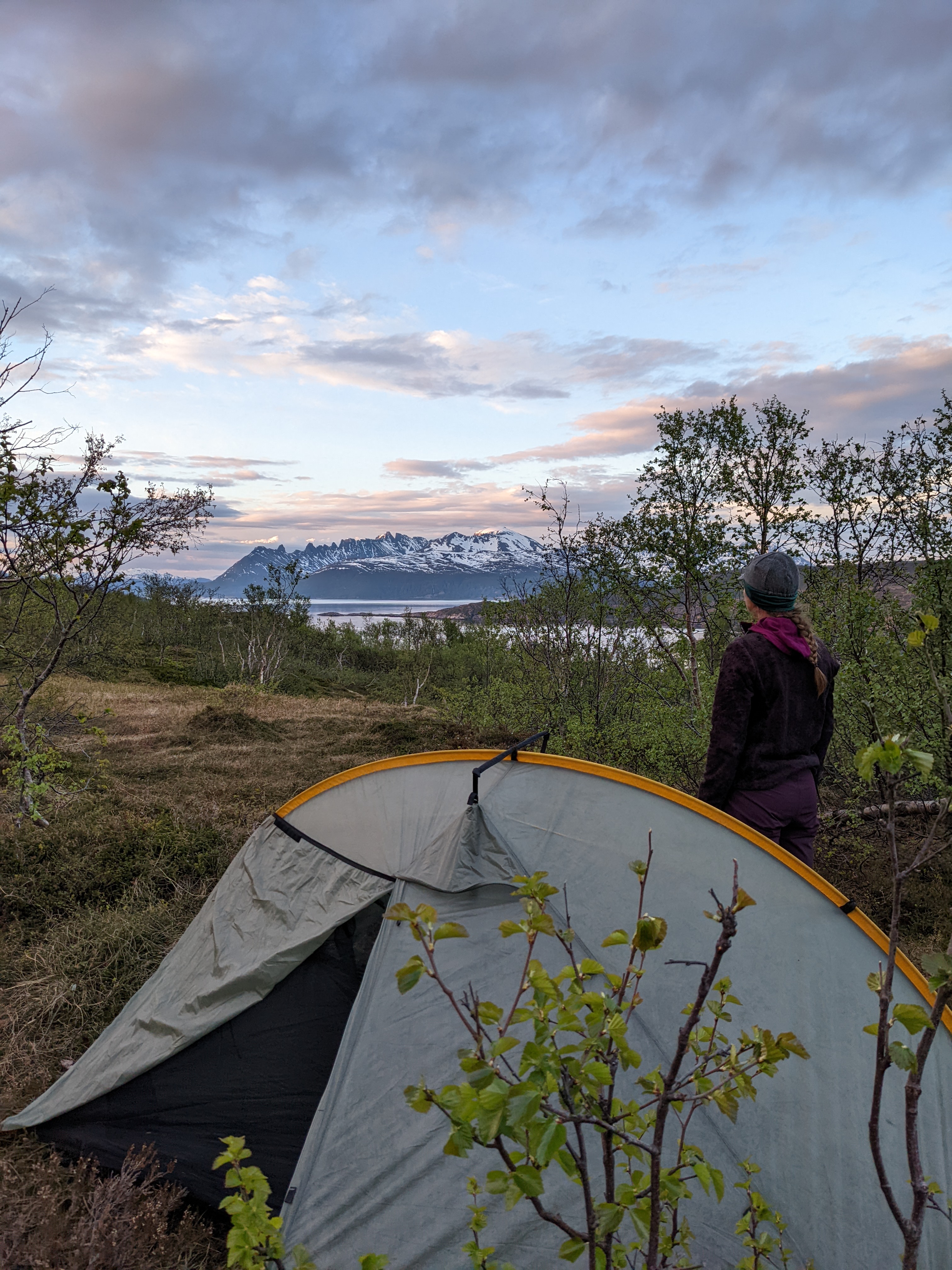 view of spiky peaks over the water from our tent site