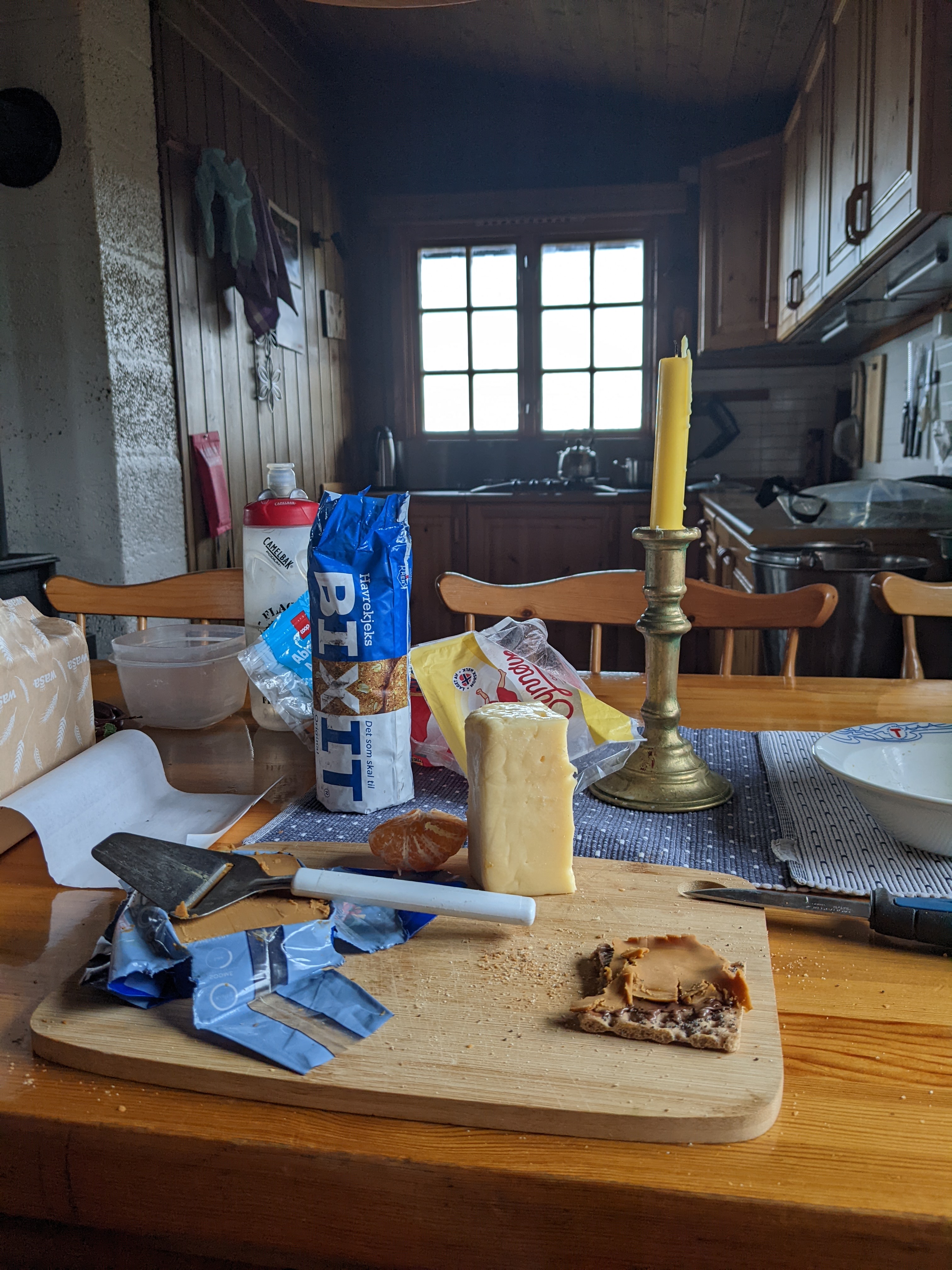 cheese, crackers, and oat biscuits on a table