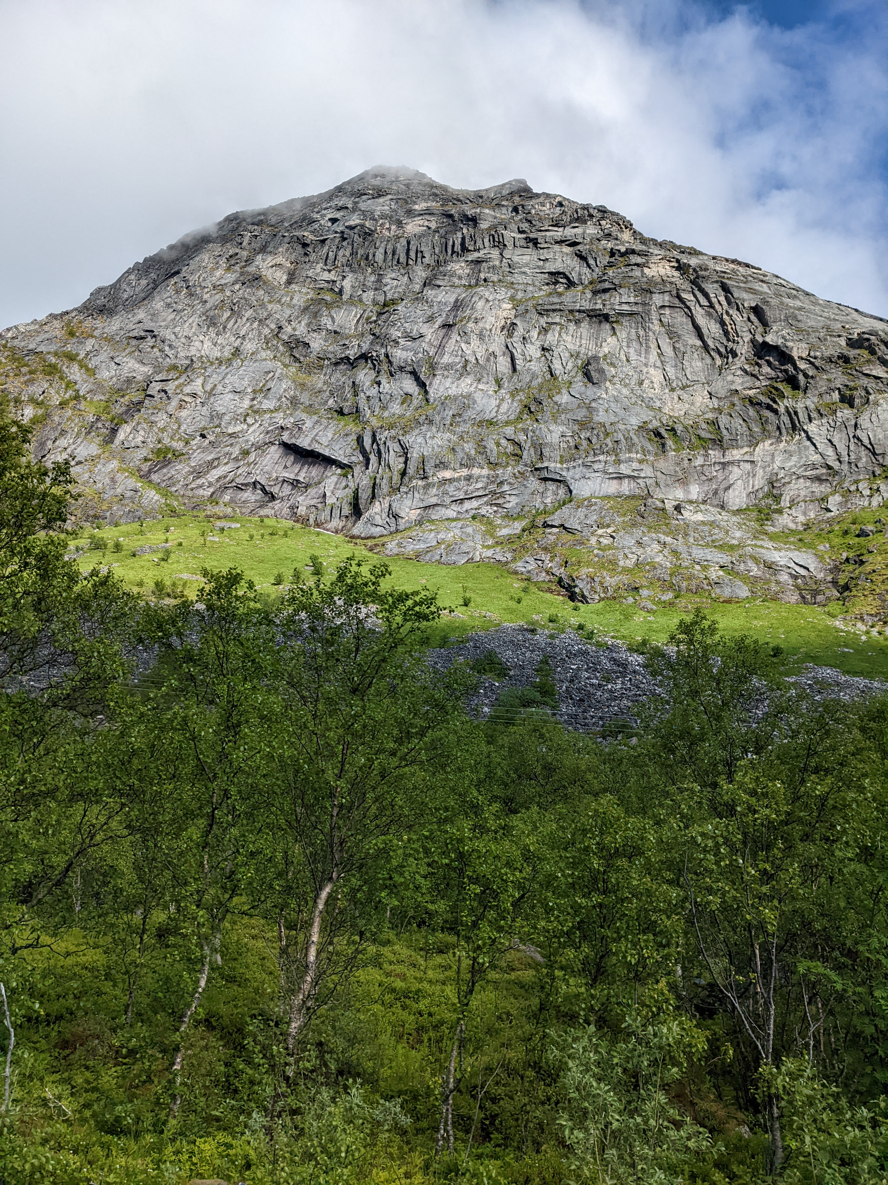 a steep, granitic-looking cliff shot from below