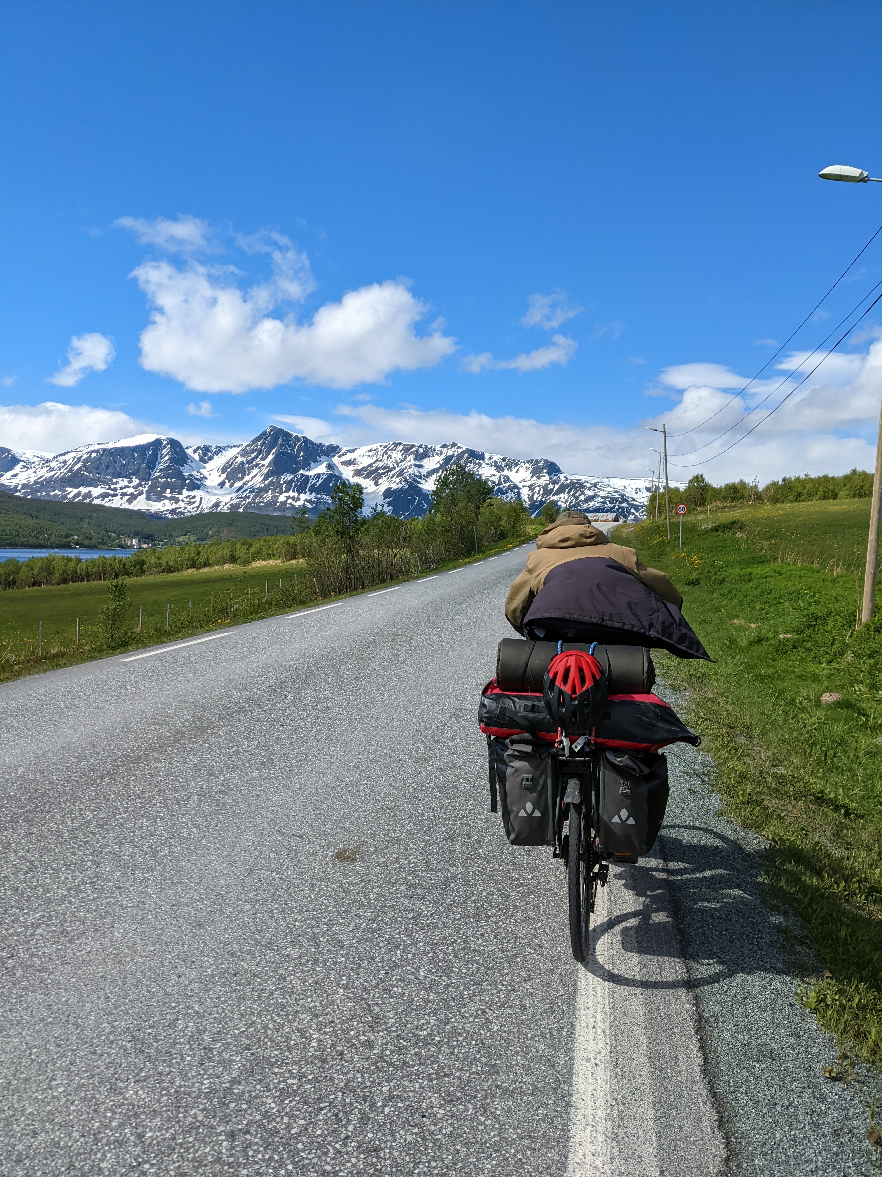 florian riding hard ahead of me, coat flapping in the wind and helmet strapped to the back of the bike