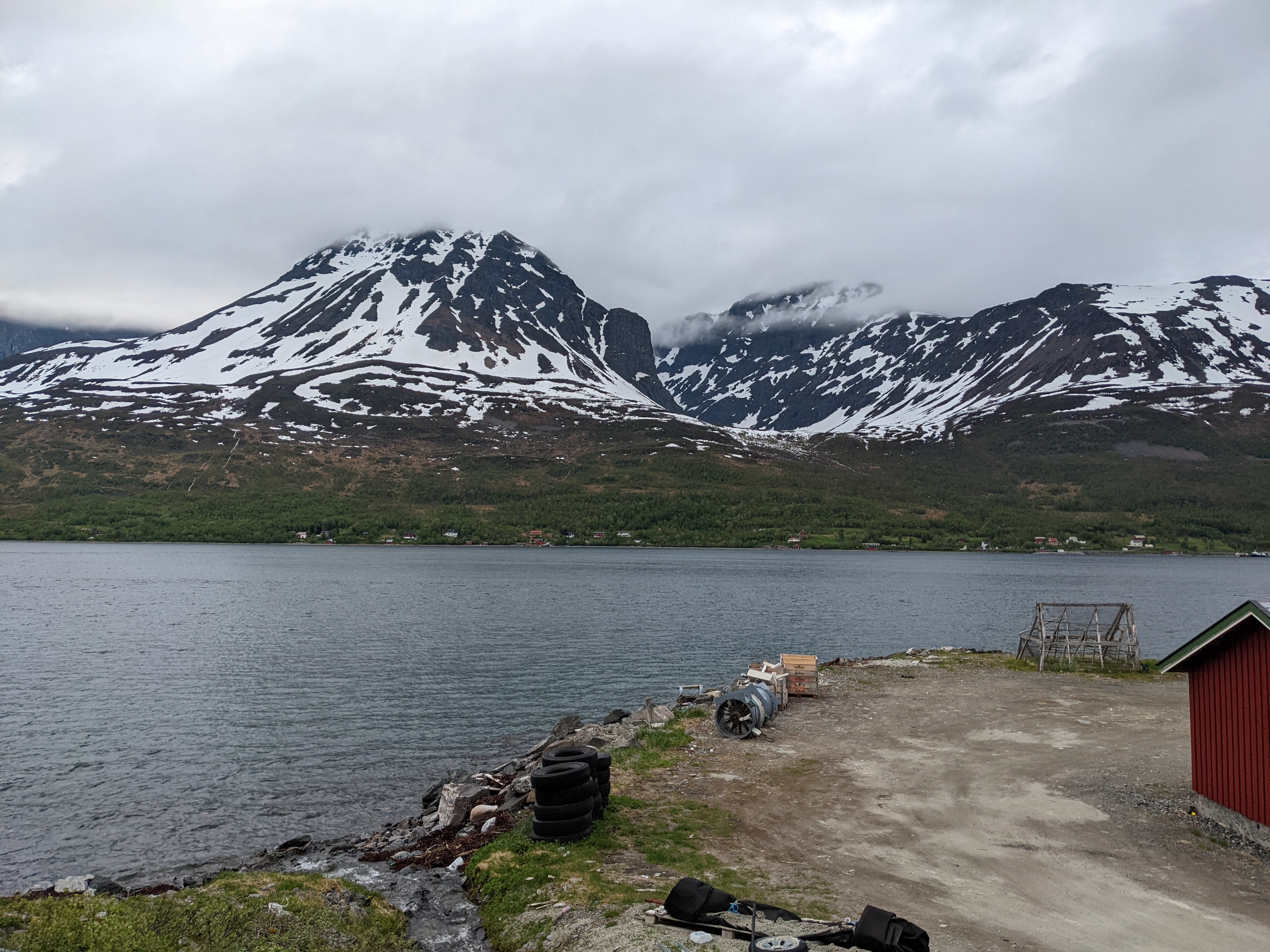 view across the water to Skervøy. houses on the far bank are visible but very small